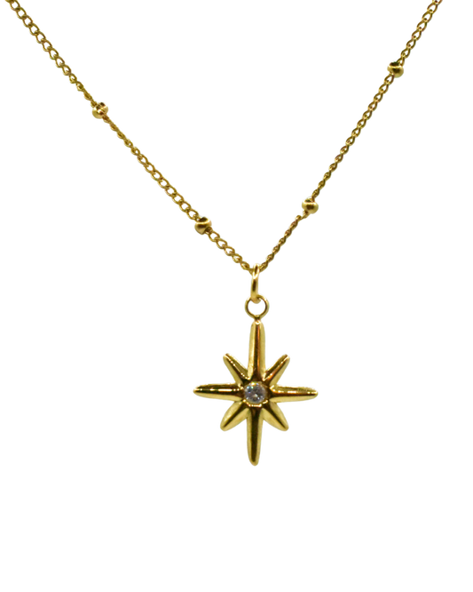 Collar dorado con colgante de estrella modelo Estrella de Auredune, detalle del acabado